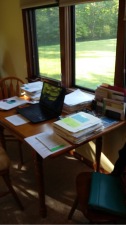 Cathy's writing table in a little cottage by a pond
